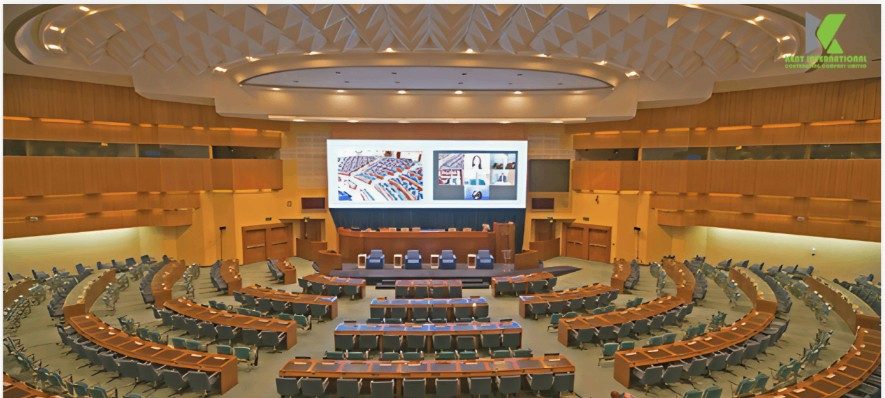 Prosperity Auditorium Hall with timber-slatted acoustic walls, stage lighting and terraced seating